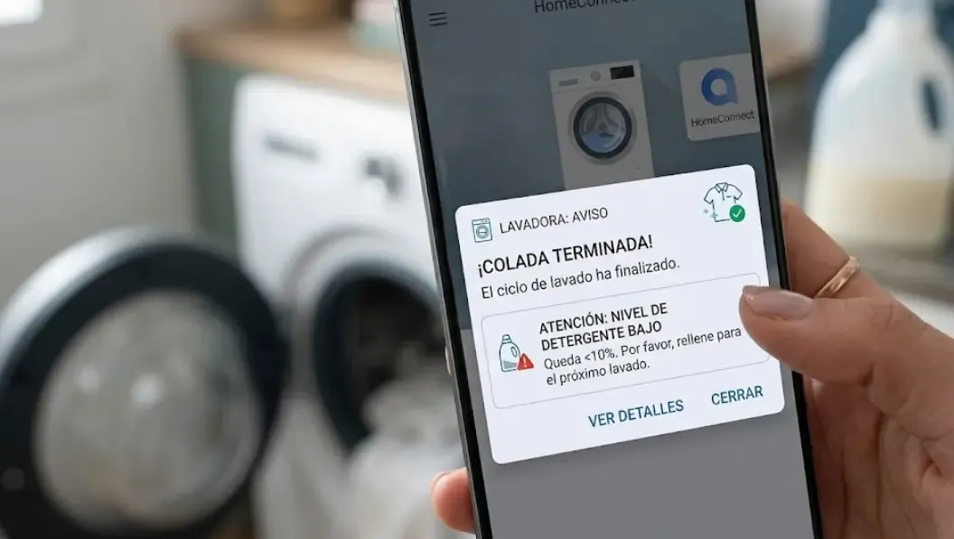 Pantalla de un teléfono inteligente mostrando una notificación emergente avisando de que el ciclo de lavado ha terminado y el nivel de detergente está bajo.